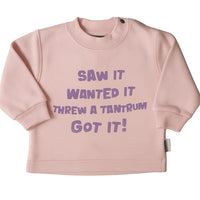 Pink sweatshirt with purple text.