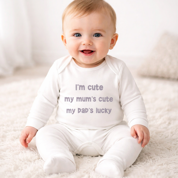 I’m Cute My Mum’s Cute My Dad’s Lucky – White Baby Romper 6–12 Months | Clearance £8.99