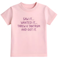 Pink t-shirt with text.