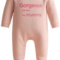 Pink baby onesie with text on a white background