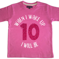 T-shirt enfant rose bonbon 'Quand je me réveille, je serai...' avec imprimé pailleté blanc et rose 